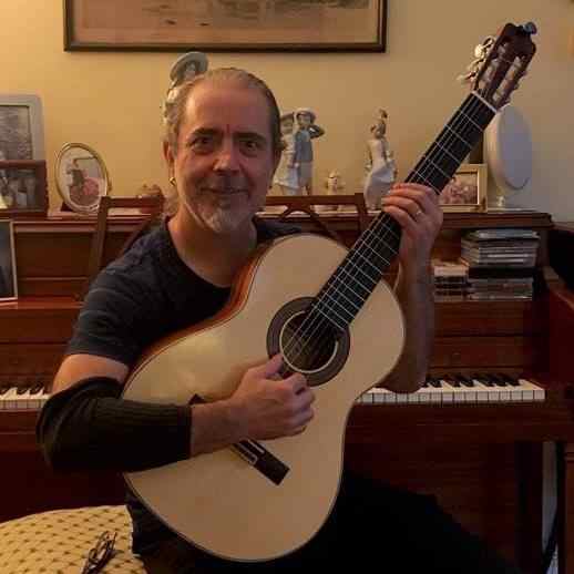 Jose Rios Nebro hold the first classical guitar he made